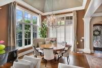 The formal dining includes 16" custom ceiling with transom and casement windows throughout.