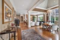 The light and bright entry includes flexible formal living and dining space with soaring ceilings.