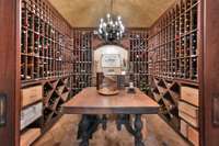 The 1,200 bottle wine room is complete with humidifier, cooling unit and French glass-panel doors.