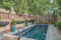 New 12'x28' PebbleTec over concrete finish heated pool (2025) has a 10' seating area with jets, and a lap lane.