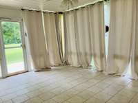 Back deck was converted to a sun room with access to the patio.