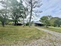 5 acres with two duplexes (2685 Lick Creek on left & 2669 Lick Creek on the right)