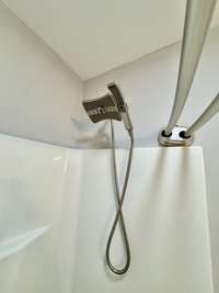 Master bath with shower/tub combo and upgraded plumbing fixture