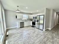 Eat-in kitchen with stainless steel appliances