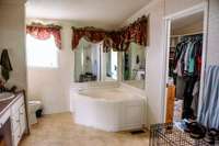 Primary bath with large closet and garden tub