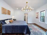 Adding an ensuite bathroom transformed the main-level master bedroom space.  At 16'x14' it provides a spacious place to rest. Walk-in closet, make-up station and shower provide a custom-designed flare to finish it off.