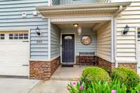 Featuring an attractive covered porch to great your family and friends, keeping them dry in the rain!