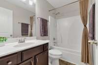 Bedrooms #2 & 3 share the upstairs Bathroom, with upgraded light fixture, extended height vanity and comfort height toilet