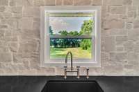 Gaze out onto the private backyard from kitchen window