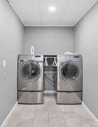 The lower level of this home also features its own full walk-in laundry room.