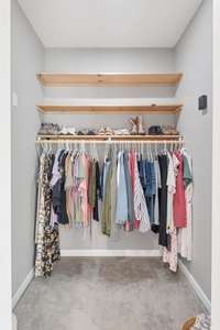 One of the walk-in closets in the Primary Bedroom Suite