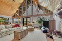 Welcome to this rustic A frame designed home , featuring spruce paneled vaulted ceilings , and views out every window.