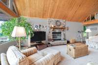 stone  faced wood burning fireplace and hand crafted oak mantle