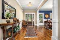 Just inside the front door you are greeted with neutral paint and gorgeous sand and finish hardwood floors.