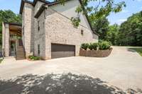 Concrete drive and oversized 30x25 bottom garage.