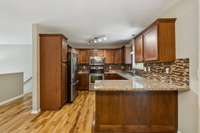 Kitchen equipped with sleek stainless steel appliances for a modern touch.