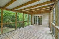 Enjoy year-round comfort on the covered, screened porch—your ideal spot for outdoor dining and relaxation.