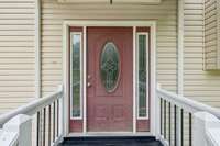 Covered front entry offers a warm welcome for guests.