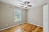 Bedroom 2 offers a comfortable space with natural light and neutral tones.