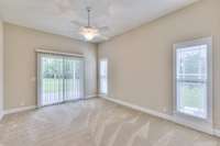 Bedroom 2 has nice sliding door to rear covered porch
