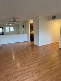 Open and spacious living and dining combination. Nice laminate floors, and freshly painted walls throughout!