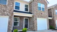 This one-street townhome development is bordered by single family homes with beautiful rolling farm fields nearby.