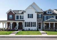 Beautiful white brick 2 story townhouse with stone front