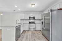 Lots of cabinets and workspace