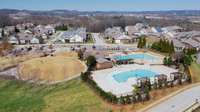 Common Area with zero line entry pool and playground, short walking distance.