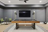 The basement area has plenty of room for friends to play pool or enjoy watching the game
