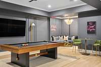 Located off the pool table space you find extra seating before you enter the theater room