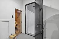 Sauna and concrete safe room in basement. Door to the left is for extra wood storage