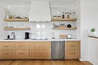 Kitchenette in guest space--cooktop, sink and mini fridge