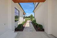 Walkway in between the guest house/garage and main residence
