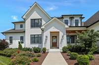 A covered porch greets you as you come up the front walk
