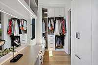 The Primary closet is a dream! California closets created a space with drawers, lighting and extensive storage options. Get ready for the day right in your closet at the make up/mirror station--or use it as your personal desk space