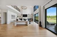 View from the kitchen into living space, Doorway to left are stairs leading to the basement