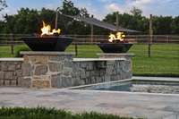 Enjoy an evening swim lit by raised fire pits
