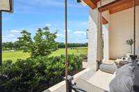 The front porch swing is a lovely spot to look over the front acreage