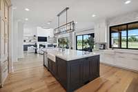 Tons of natural light due to almost an entire wall of windows facing back of the house