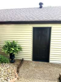 2 Car Garage--installed man door to get to garage from front door; New Door also has key pad  entrance