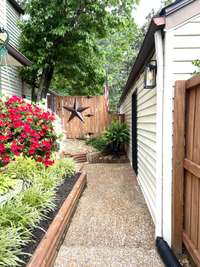 Beautiful landscaping going to front door;