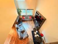 Living Room downstairs with hardwood flooring; Home has been totally renovated
