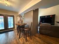 Den/Eat In area; great area for small or large table for eating; Flows into the Living Room Hardwood, Tile and Carpet floor coverings