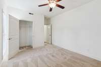 Main floor bedroom #3 showing large walk in closet. This room could be an office.