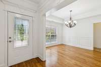 Formal Dining room w/coffered ceiling and 3/4" sand and finish oak hardwood.