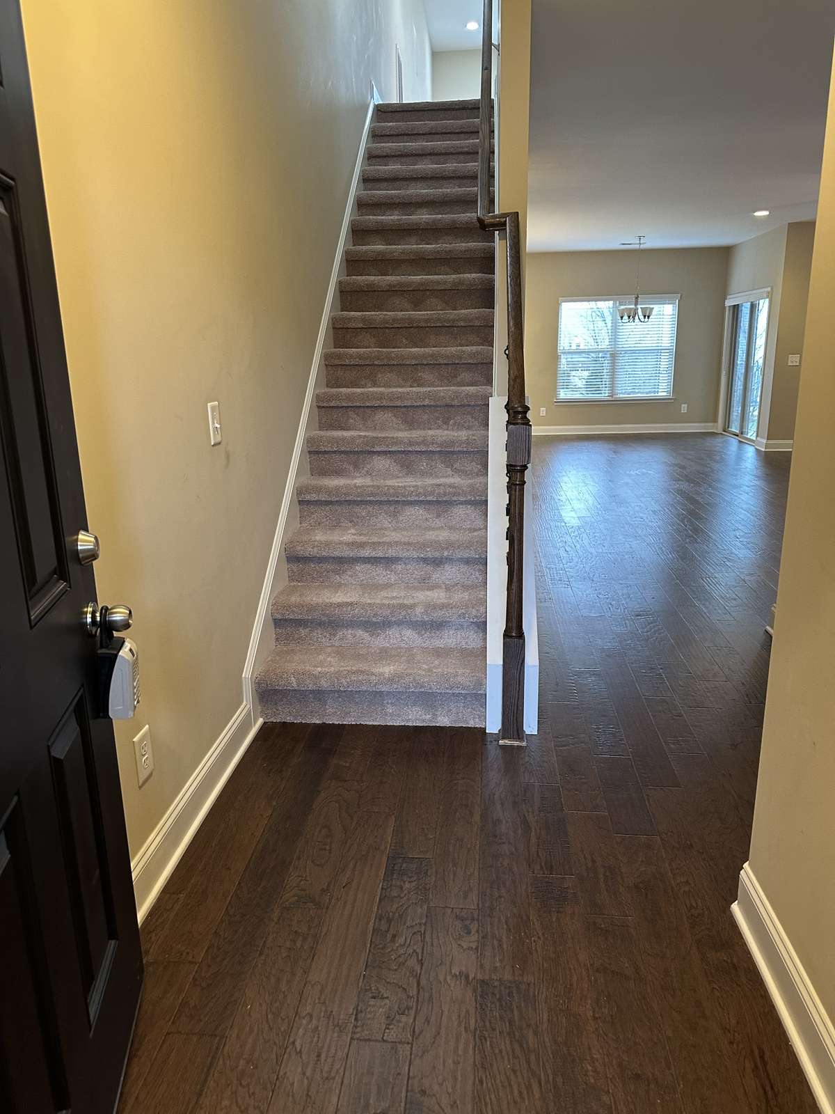 FRONT ENTRANCE.  BONUS ROOM STAIRWAY