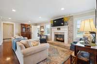 Main level living room w/ cozy fireplace