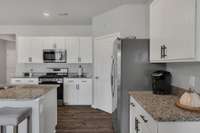 The convenient layout of this kitchen is one main reason this floor plan is the most sought after!