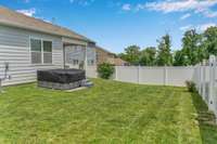 Backyard side view. Can you see yourself relaxing in the hot tub here?